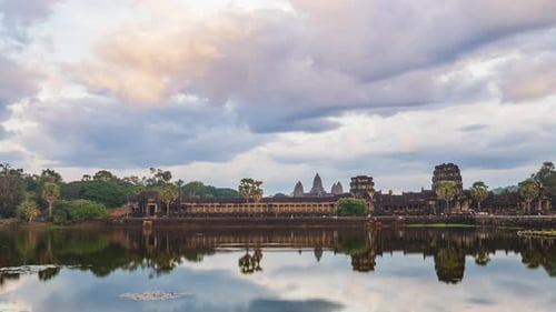 Sunset time lapse at Angkor Wat main facade reflection on water pond, Cambodia
