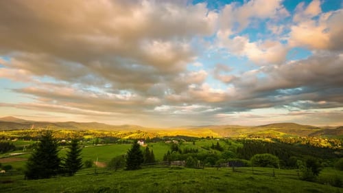 Time Lapse of Blue Sky with Clouds Over Mountain