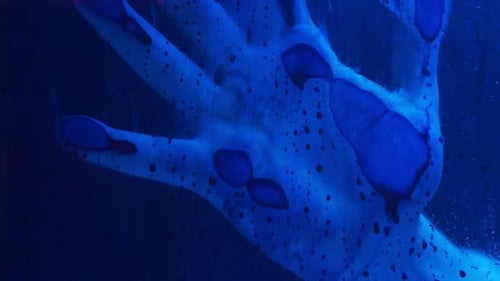 Abstract Hand Behind Glass with Neon Lighting