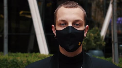 Portrait Man Wearing Protective Face Mask Look at Camera COVID-19 Coronavirus Infection Near Airport