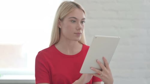 Woman Uses Tablet Device Indoors
