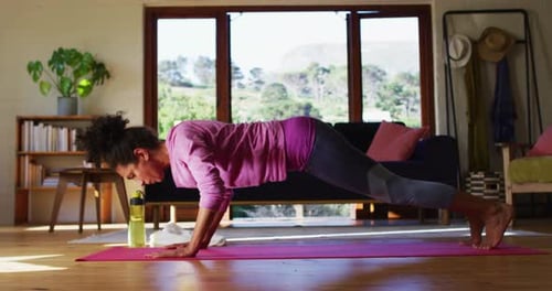 Woman Doing Push-Ups in Bright Home Setting