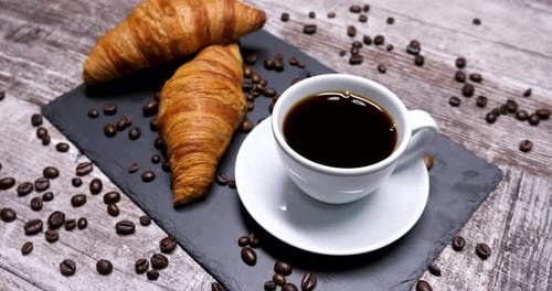 Coffee and Croissant Still Life on Wooden Table