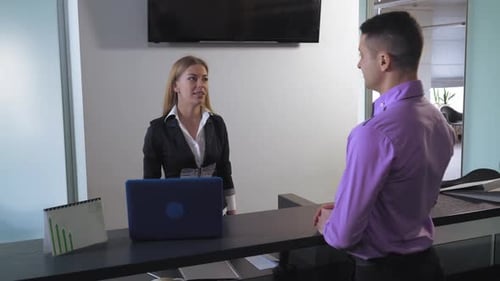 Manager Has Conversation with Customer.