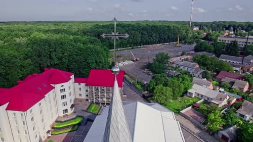 Aerial View of a Church with Cross in the City
