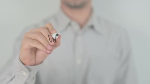 Man Writes 'Well Done' on Clear Surface
