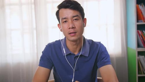 Young Man Discussing Technology Indoors During Meeting