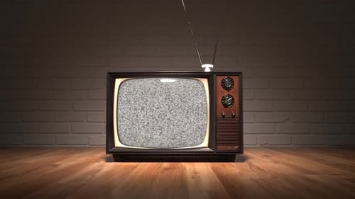 Old-fashioned vintage tv with the antenna on the wooden floor in the apartment.