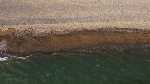 Aerial View From Above on Azure Sea and Pebbles Beach