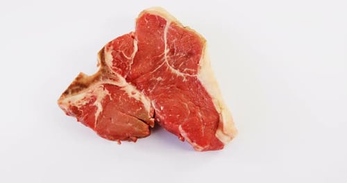 Raw steak on white background