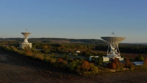 Radio Telescope Dishes in Rural Autumn Landscape