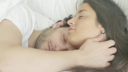 Couple sleeping in bed