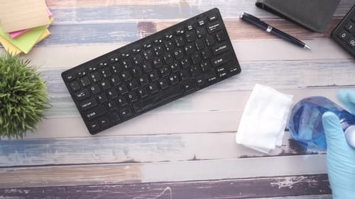 Sanitizing Keyboard With Spray and Cloth