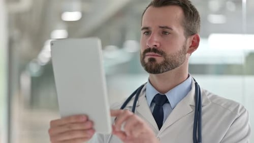 Doctor Using Tablet in Medical Setting