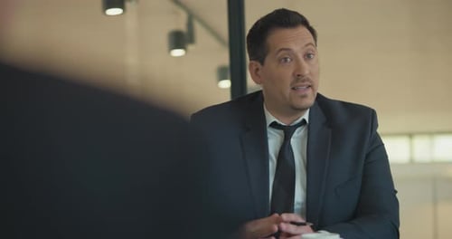 Professional Man Gesturing During Business Meeting