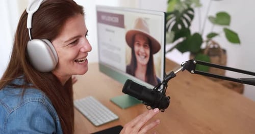 Woman Recording a Podcast at Her Home Desk