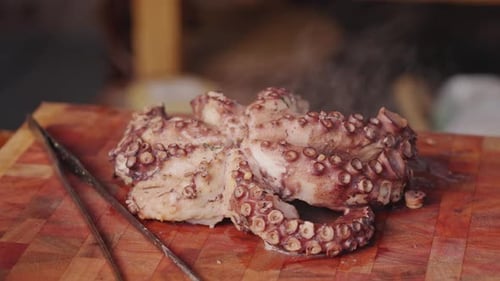 Steaming Cooked Octopus on a Cutting Board