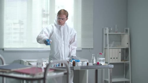 Scientist Mixing Chemicals in Laboratory