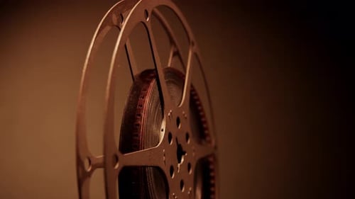 Vintage Film Reel Rotating in Close Up