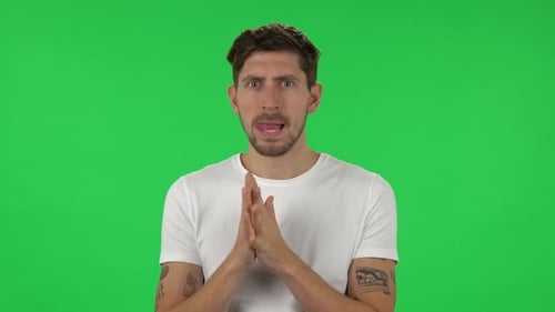 Man Thinking, With Hands Together, on Green Screen