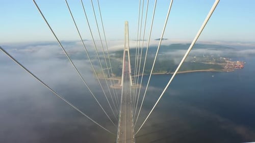 Drone Flight Over the Support of the Bridge Built Across the Sea Strait at Dawn