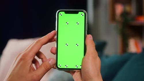 Closeup of Smartphone with Green Screen Young Man Hands Holding Mobile Phone Zoom in Isolate Display