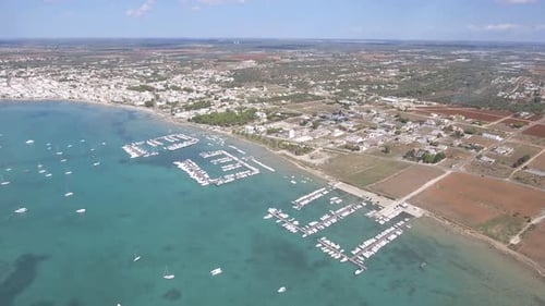Beautiful tourist port aerial view with emerald water in southern Italy