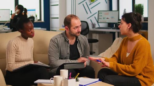 Consultant Greeting Diverse Business Clients with Handshake