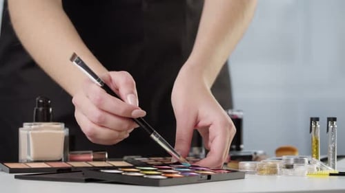 Makeup Artist Swatching Eyeshadows On Hand for Color Analysis