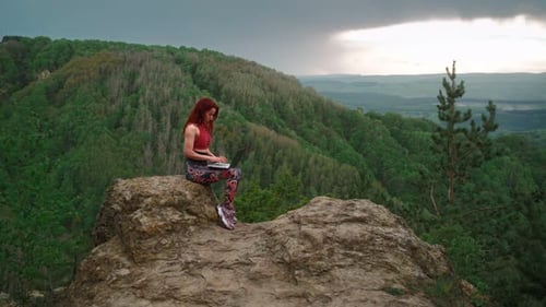 Woman Freelancer Works Laptop on Top Mountain Backdrop Stunning Mountain