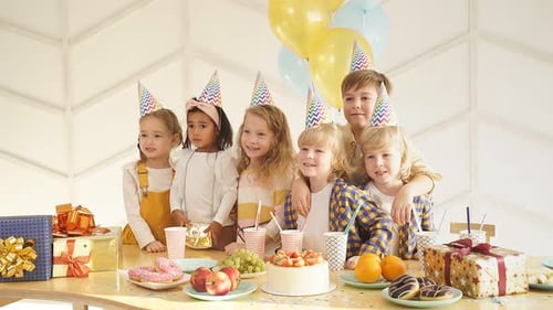 Happy Children Smiling at a Birthday Party