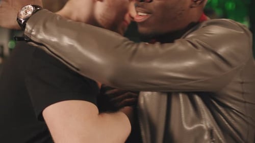 Men Greeting Each Other At Bar