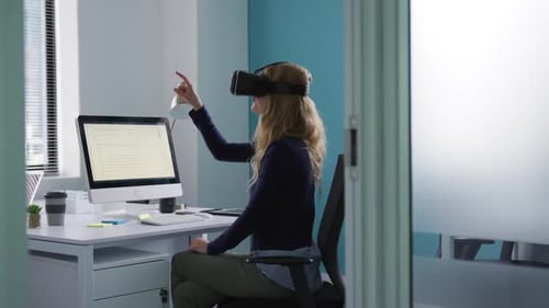Woman Uses VR Headset in Modern Office