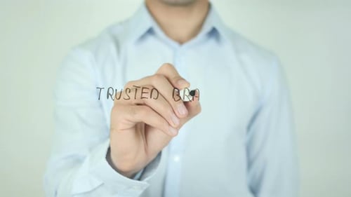 Writing Trusted Brand on Glass Close Up