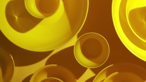 Vibrant Yellow Bowls and Plates Arranged Geometrically