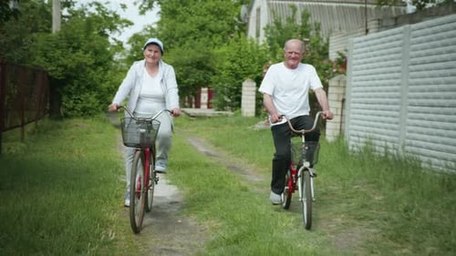 Senior Couple Riding Bicycles on a Rural Path