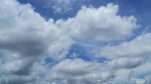 White Clouds Moving Across a Blue Sky