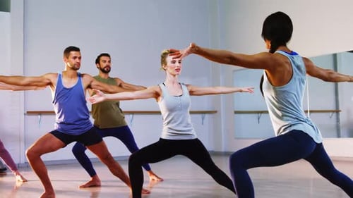 Instructor taking yoga class