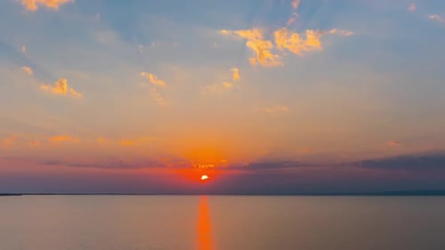 Sunset Over Calm Water Aerial View