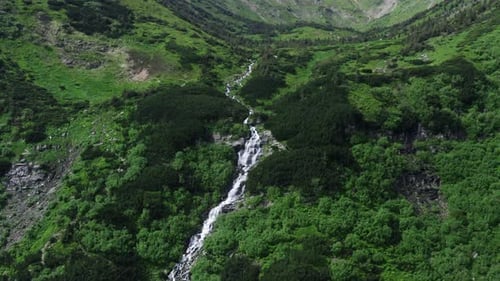 Aerial View of Lush Mountain Waterfall
