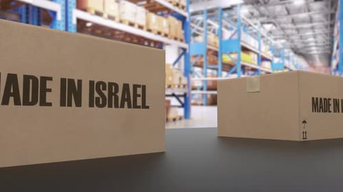 Boxes with MADE IN ISRAEL Text on Conveyor