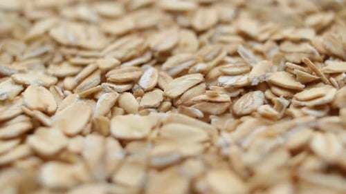 Great Background of Whole-grain Organic Oatmeal Rotating Close Up