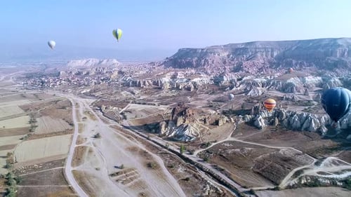 Aerial View of Hot Air Balloons Over Landscape