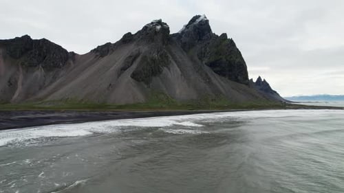 Drone Flight Over Sea Black Sand Beach And Vestrahorn Mountain