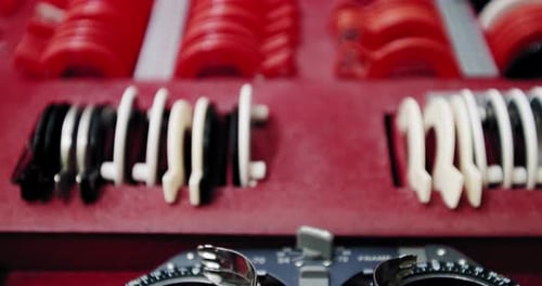 Case with Set of Lenses, Optometrist Diopter Tools in an Optician Laboratory. Diagnostic Lenses Kit