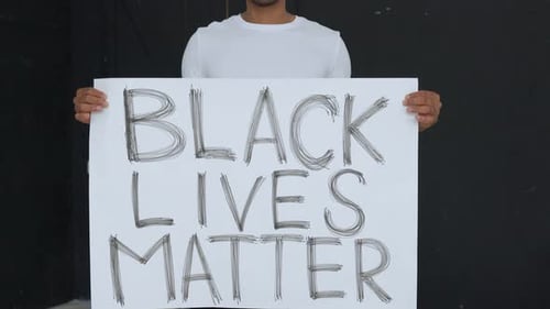Young Adult Holding Black Lives Matter Sign