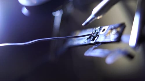 Close-up Working with a Soldering Iron at Workshop. Concept of the Profession, Accurate Work