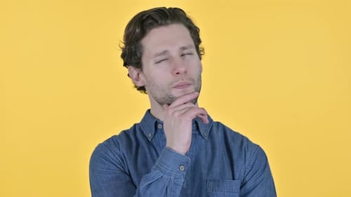 Man Thinking Has an Idea and Smiles