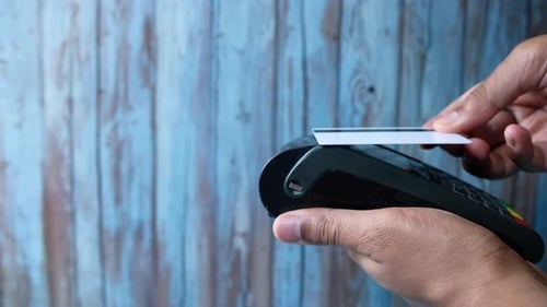 Inserting Card into Card Reader for Payment