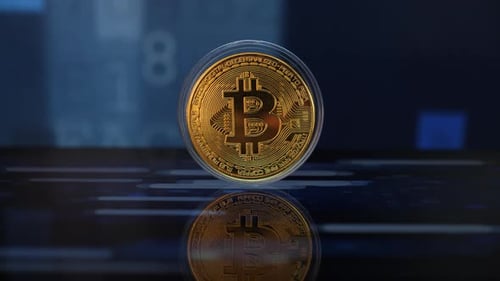 Gold Bitcoin Coin on Digital Background